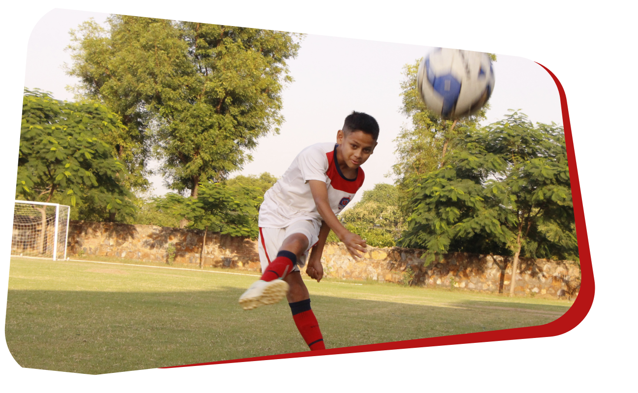 Residential school student dribbling past a defender